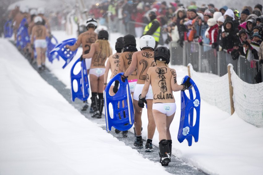 Naked Snow-Sledding Competition In Saxony